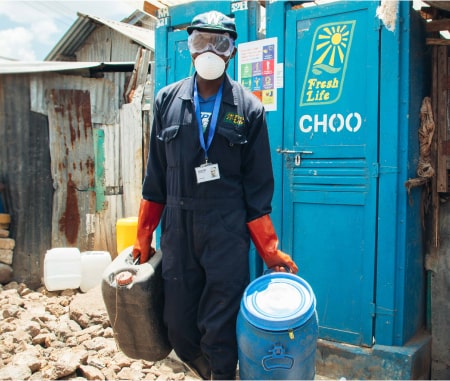 Fresh life staff cleaning a Fresh life toilet